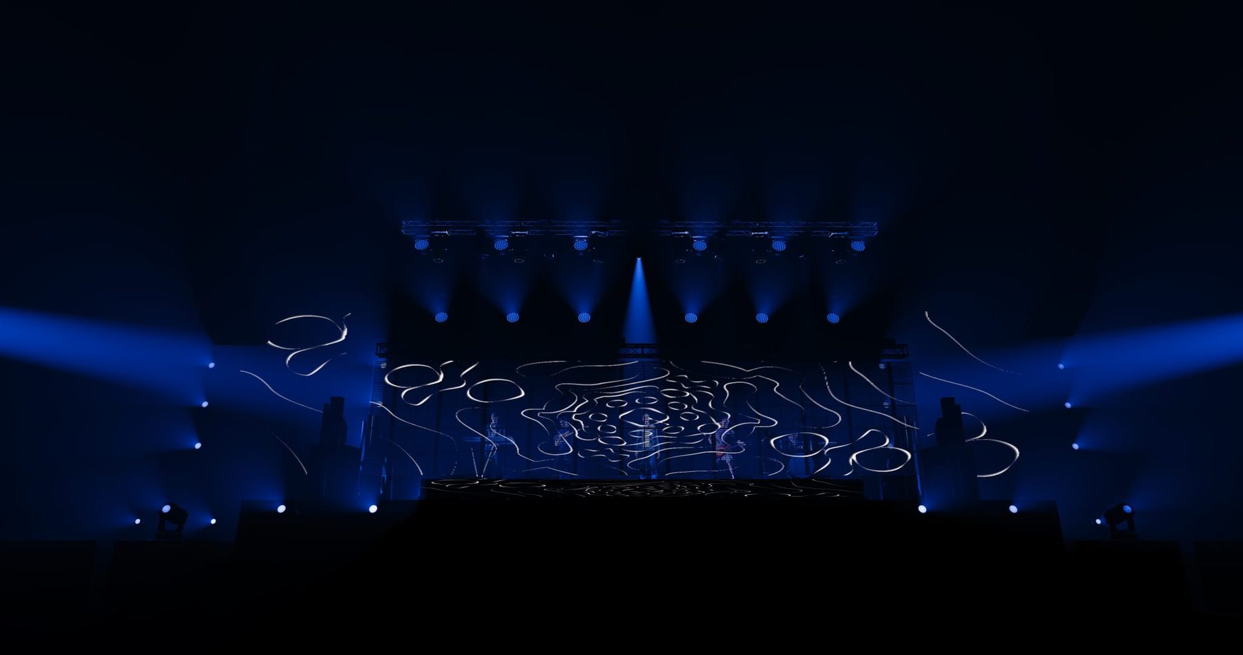 Palco panoramico con impianto luci durante il concerto.